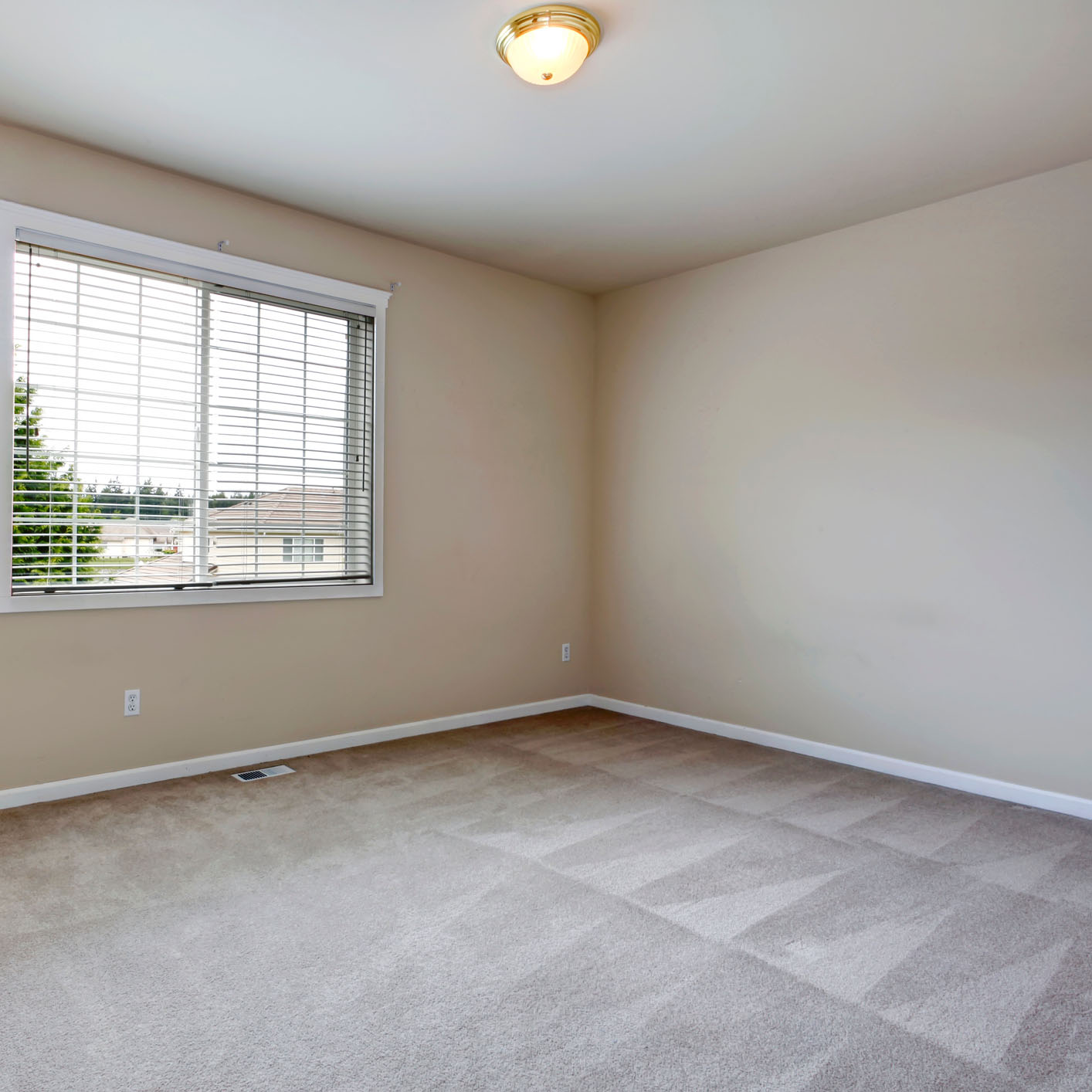 Freshly cleaned carpet in empty bedroom following fast-drying green carpet cleaning in Anaheim Hills