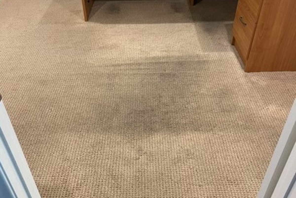 Dirty natural fiber carpet before deep extraction carpet cleaning and stain removal in Southern California