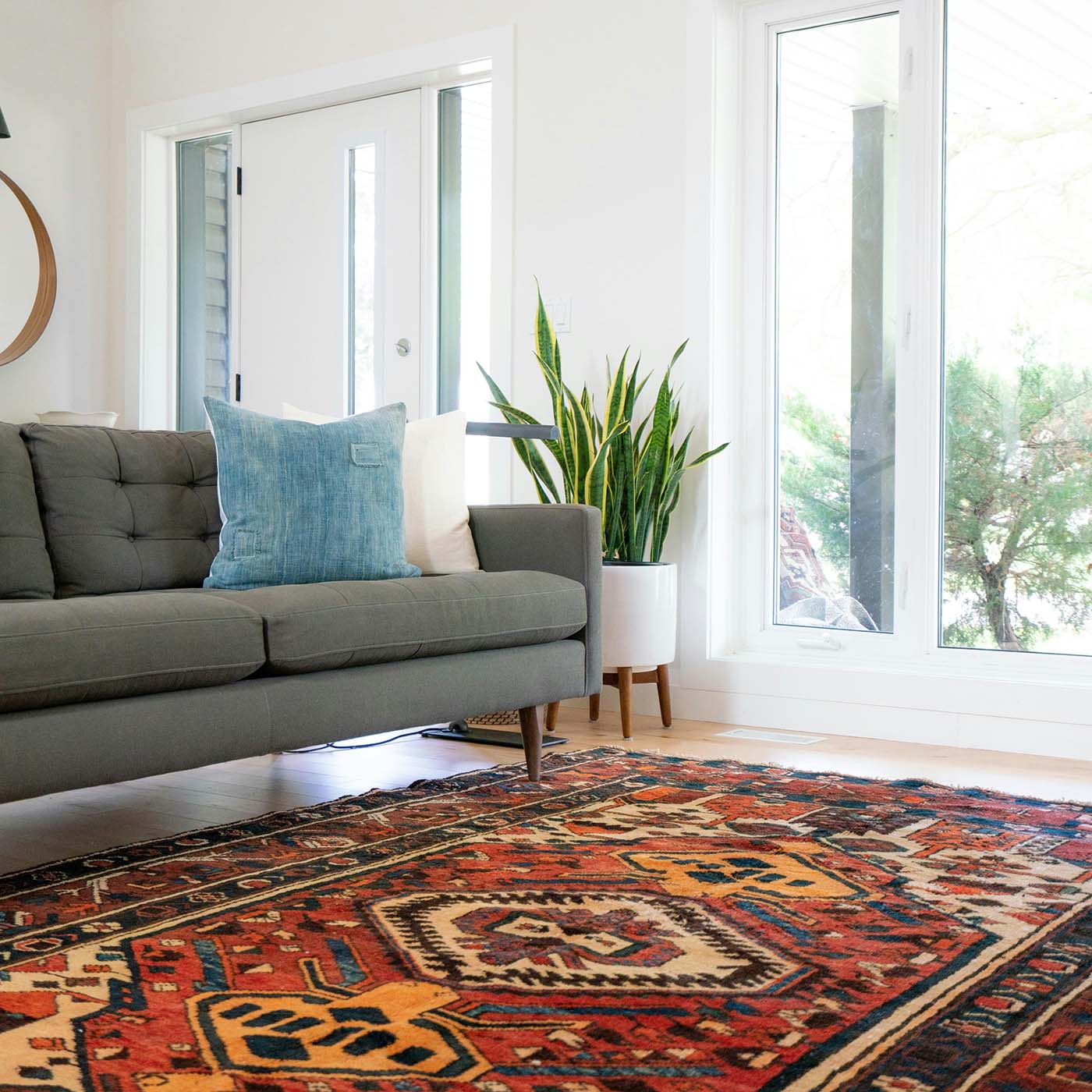 Clean oriental area rug in bright living room after non-toxic rug cleaning service in San Bernardino County